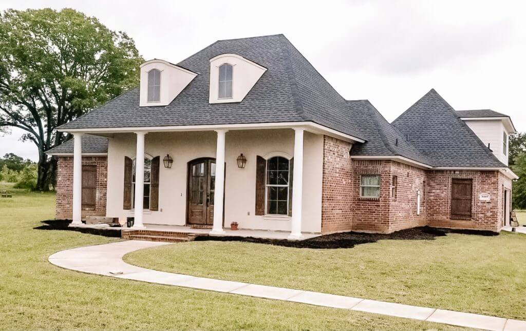 home with black mulch landscaping