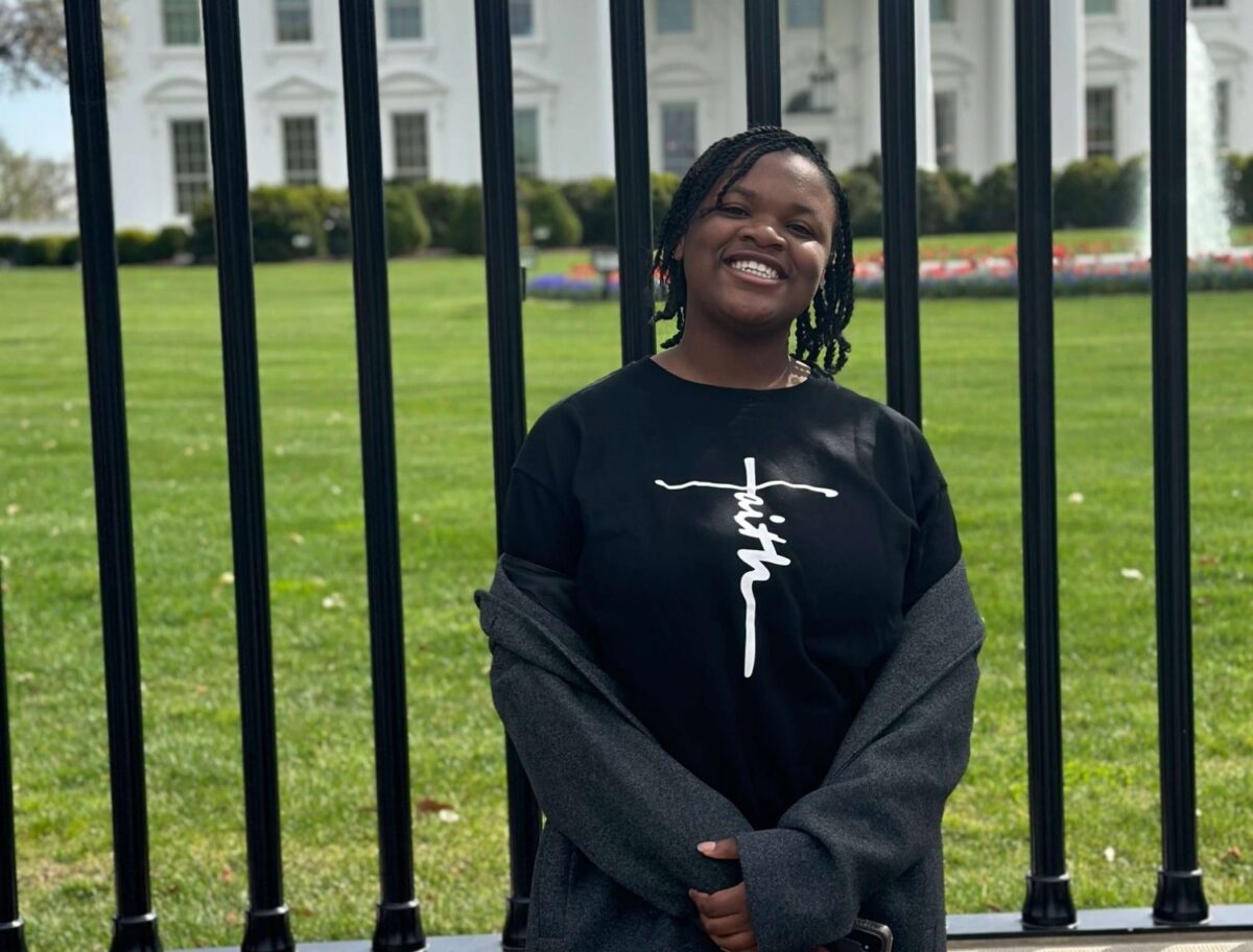 female in front of the White House